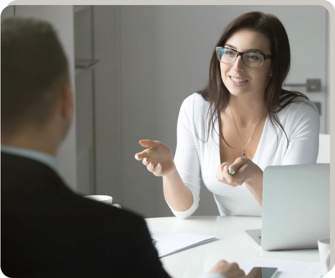 A woman sitting at a table with a man.